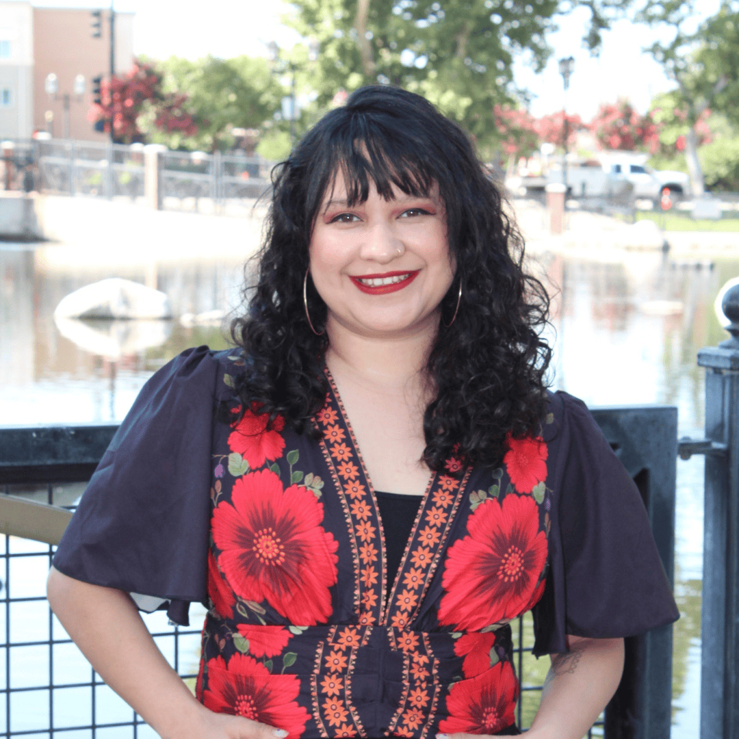 Headshot of Bree Martinez. She is wearing red and black floral shirt.